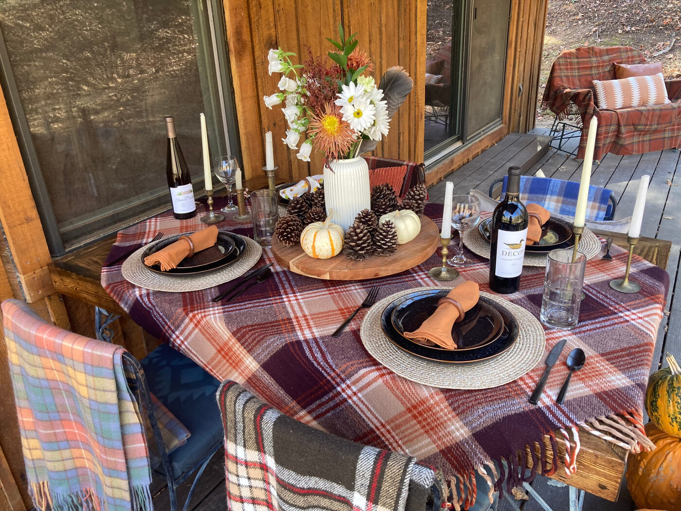 Place settings with copper napkins and small white pumpkins